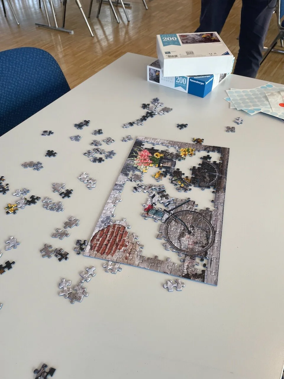 An unfinished jigsaw puzzle on a workshop table